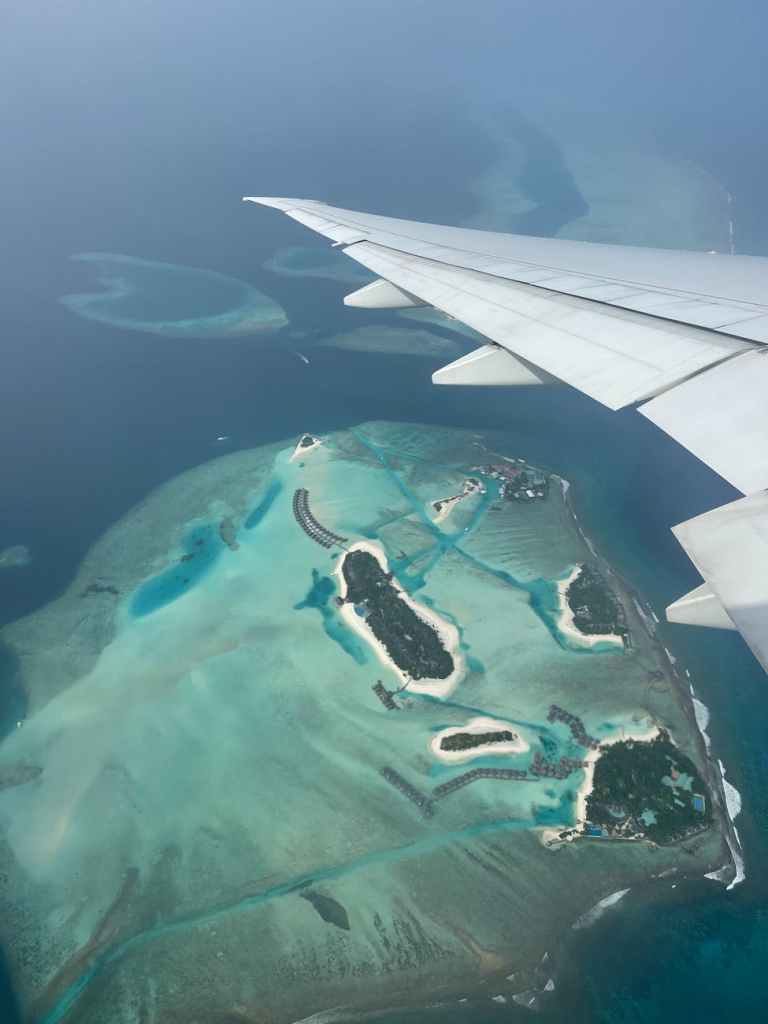 aerial view of maldivian islands from airplane